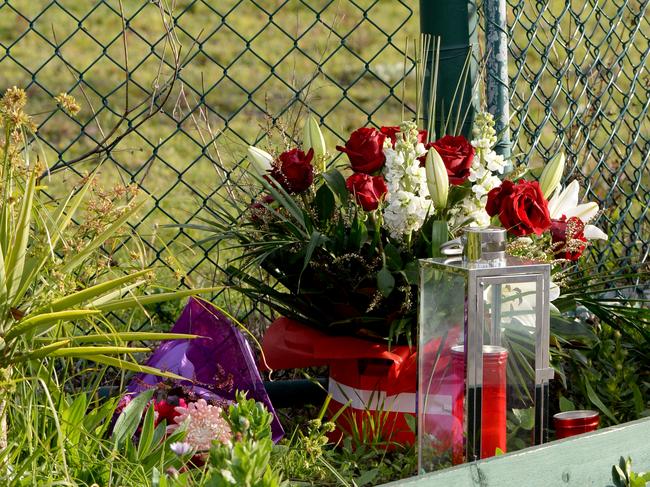 Flowers left for a St Basil's Aged Care resident who died of Covid. Picture: Andrew Henshaw