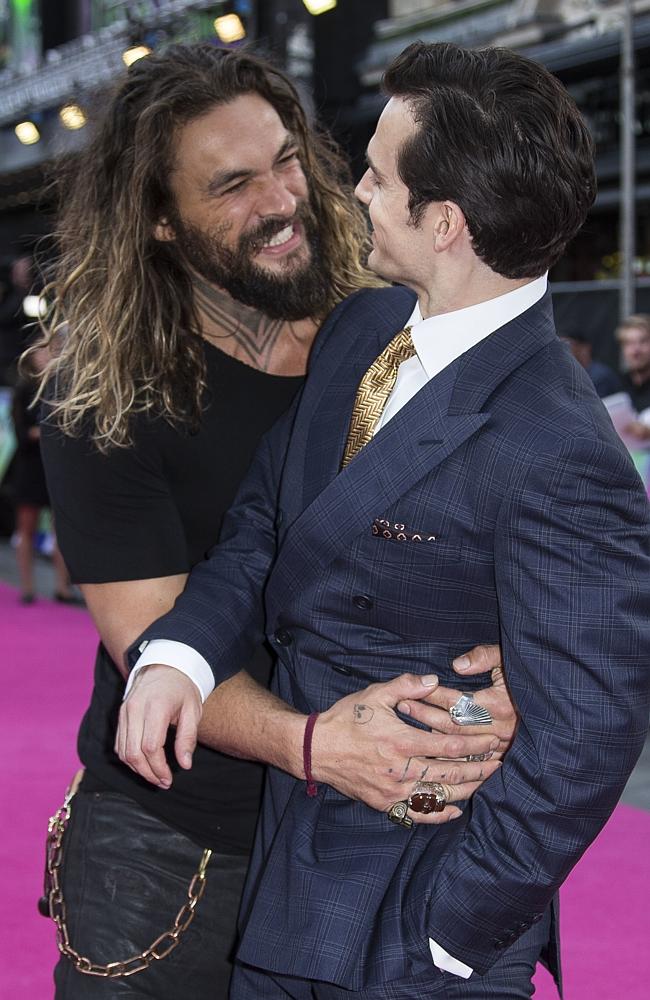 Jason Momoa hugs Henry Cavill at the European Premiere of “Suicide Squad” at the Odeon Leicester Square on August 3, 2016 in London, England. Picture: AP