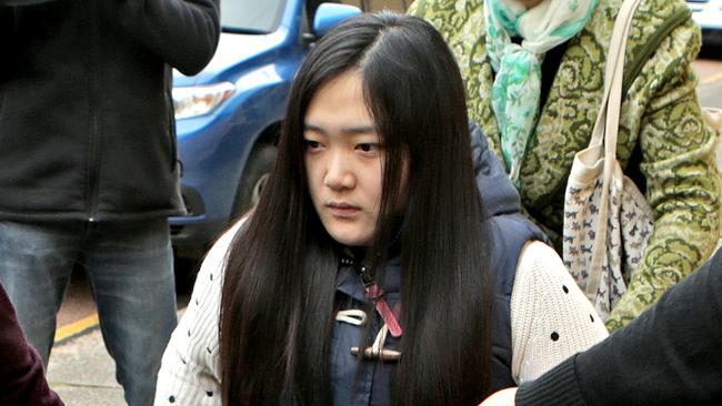 GLEBE Coroners Court; Yinuo ÒGingerÓ Jiang, 27,(in wheelchair) leaving court Yinuo ÒGingerÓ Jiang survived after jumping from a ninth storey window from a burning building in Bankstown in 2012. Inquest to begin into death of Pingkang Zhang, who died after jumping from a ninth storey window from a burning building in Bankstown in 2012. pic Stephen Cooper