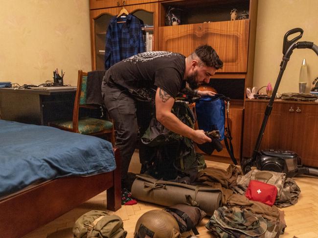 A Ukraine reservist, 28-year-old Anton Lytvyn, packs his military equipment at his house after he was called up to active duty in Kyiv. Picture: Chris McGrath / Getty Images