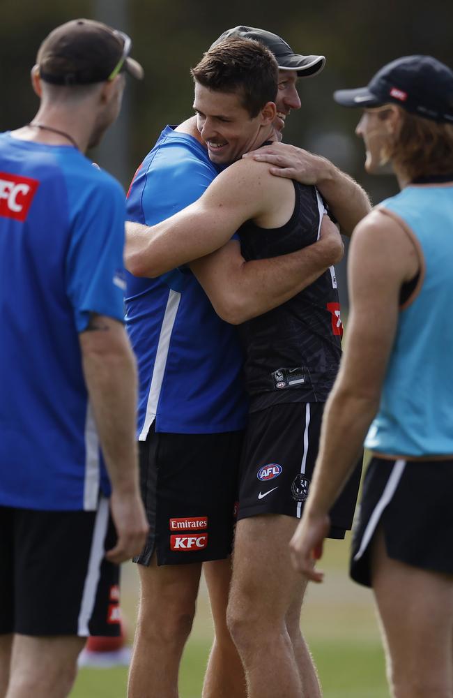 Charlie Dean of the Magpies is congratulated by assistant coach Josh Fraser. Picture: Michael Klein