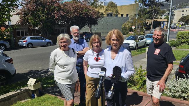 Save UTAS Co-Chair Angela Bird and supporters speak to the media at Sandy Bay on Wednesday, November 6, 2024.