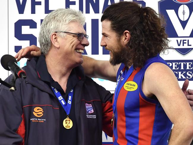 Gary Ayres and Toby Pinwill on the premiership dais.