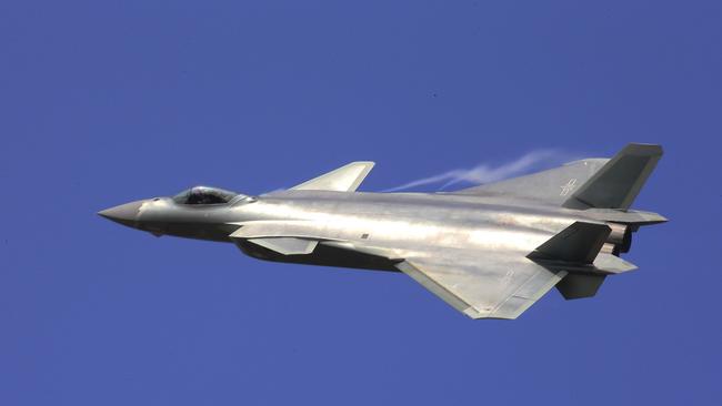 In this photo provided by China's Xinhua News Agency, the J-20 stealth fighter jet flies at the China's International Aviation and Aerospace Exhibition in Zhuhai on Tuesday, Nov. 1, 2016. (Li Gang/Xinhua via AP)