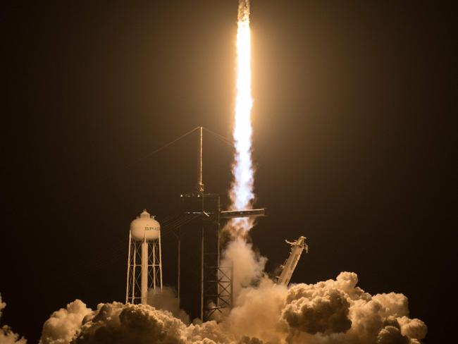 This handout image courtesy of NASA, shows a SpaceX Falcon 9 rocket, carrying the Crew-2 mission astronauts, lifting off from launch complex 39A at the Kennedy Space Center in Florida on April 23, 2021. - SpaceX is set to launch its third crew to the International Space Station early April 23, 2021, reusing a rocket and crew capsule in a human mission for the first time.  The Crew-2 mission blasts off from pad 39A at the Kennedy Space Center in Florida at 5:49 am Eastern Time (0949 GMT), after being delayed a day by adverse weather along the flight path. (Photo by Aubrey GEMIGNANI / NASA / AFP) / RESTRICTED TO EDITORIAL USE - MANDATORY CREDIT "AFP PHOTO / NASA / AUBREY GEMIGNANI " - NO MARKETING - NO ADVERTISING CAMPAIGNS - DISTRIBUTED AS A SERVICE TO CLIENTS