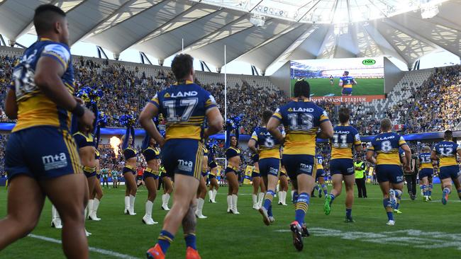 The Eels run out for the first time at their new home ground, Bankwest Stadium, on Easter Monday. (AAP Image/Dean Lewins)