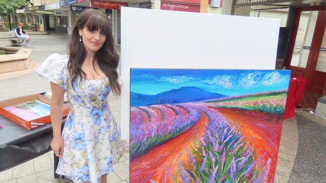 Artist Eleonora Pulcini shows her skills in finger painting. Picture: Alison Foletta