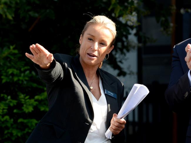 Justine Harris conducts the auction at 2/45 York St, Richmond. Picture: Andrew Henshaw