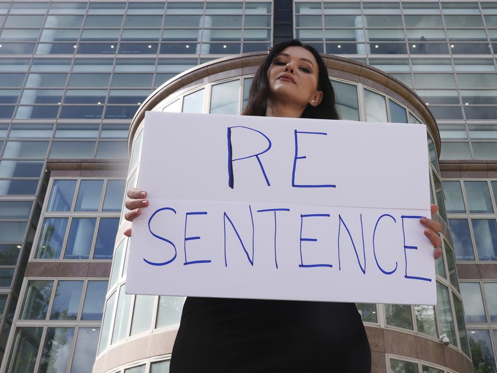 Natasha Blasick holds a sign in support of Erik and Lyle Menendez outside the Van Nuys Courthouse. Picture: AP