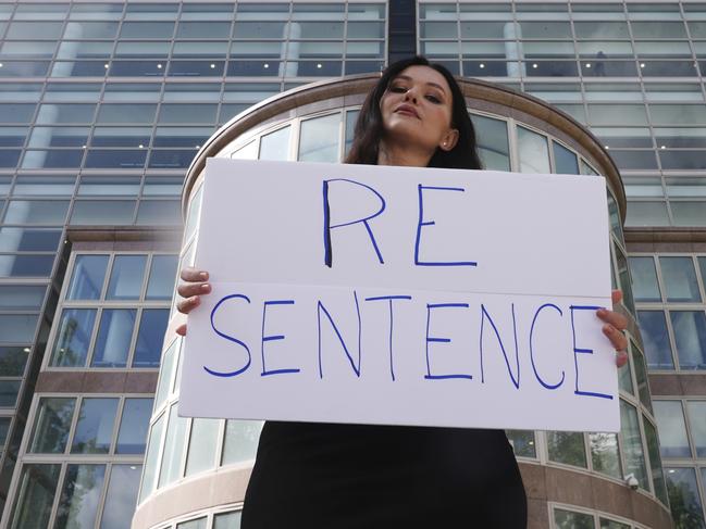 Natasha Blasick holds a sign in support of Erik and Lyle Menendez outside the Van Nuys Courthouse. Picture: AP