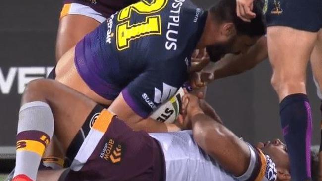 Thaiday grabs at Bromwich's injured hand.