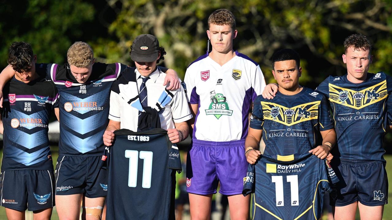 Caloundra State High School and Mabel Park State High School players stand together for a moment of silence in honour of Sunshine Coast student and rugby league talent Benjamin Hunter. Picture: Kylie McLellan