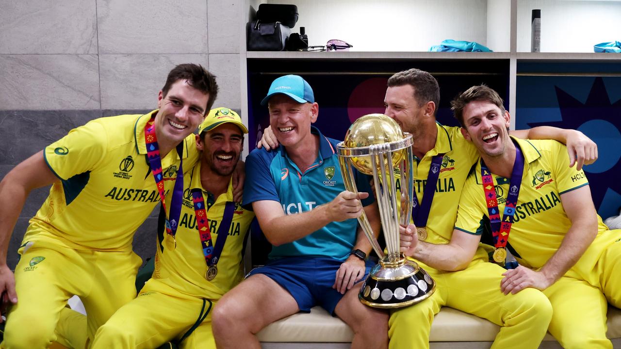 AHMEDABAD, INDIA - NOVEMBER 19: Pat Cummins, Mitchell Starc, Josh Hazlewood, Mitch Marsh and Andrew McDonald, Head Coach of Australia poses with the ICC Men's Cricket World Cup Trophy following the ICC Men's Cricket World Cup India 2023 Final between India and Australia at Narendra Modi Stadium on November 19, 2023 in Ahmedabad, India. (Photo by Robert Cianflone/Getty Images)