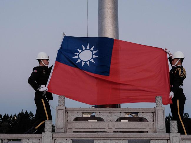 Guards raise Taiwan's national flag on the Democracy Boulevard at the Chiang Kai-shek Memorial Hall in Taipei on January 14, 2024. Picture: Yasuyoshi Chiba / AFP