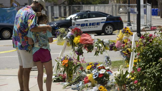 Scene of crime ... People visit a makeshift memorial near the Emanuel AME Church on Thursday. Picture: Brendan Smialowski/AFP