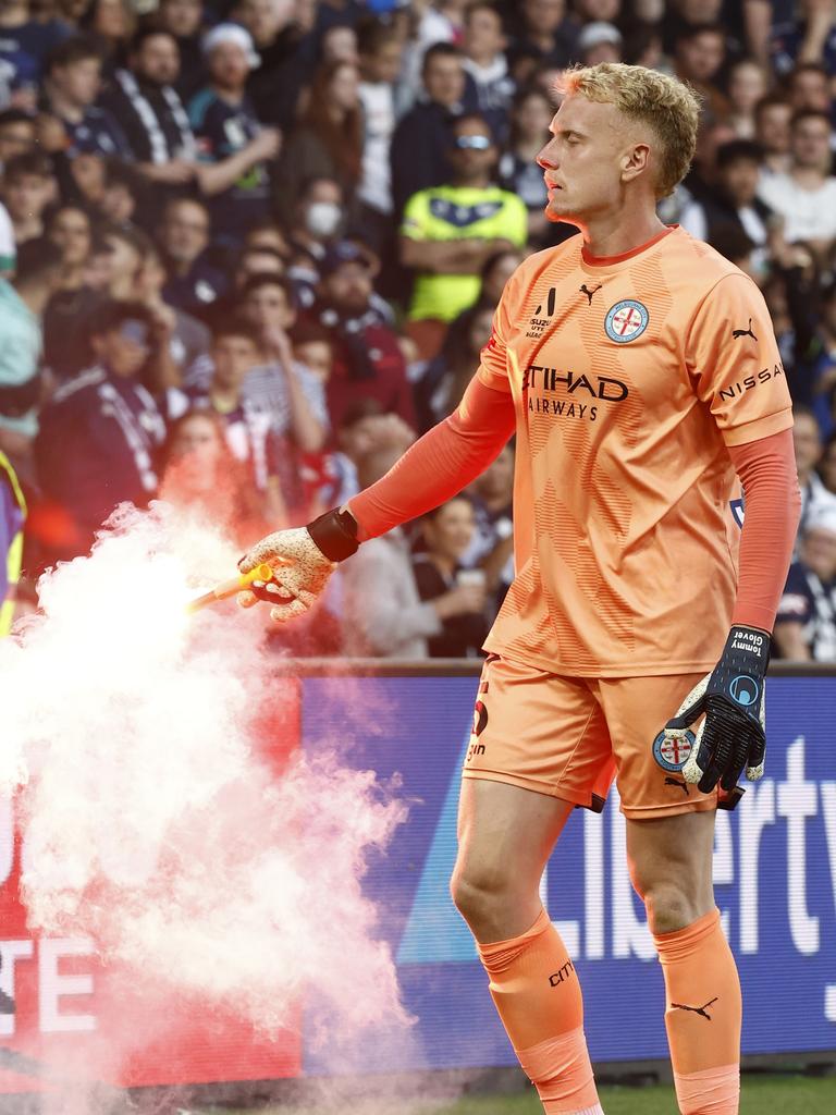 Tom Glover picks up a flare. Picture: Darrian Traynor/Getty