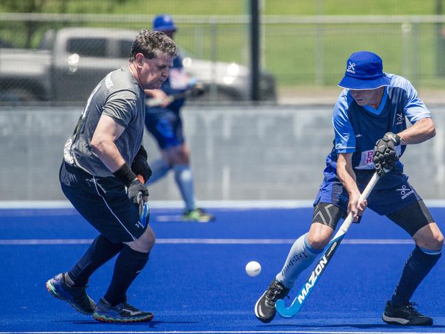 Action in the Pan Pacific Masters Games Hockey tournament. Picture: Glenn Campbell
