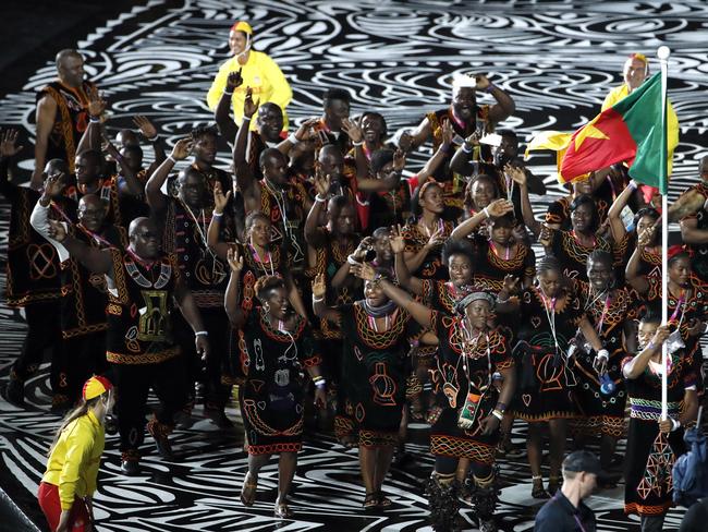 The Cameroon team marches into Carrara Stadium for the Commonwealth Games opening ceremony on the Gold Coast, before it emerged that eight of their athletes had vanished. Picture: AP Photo/Mark Schiefelbein