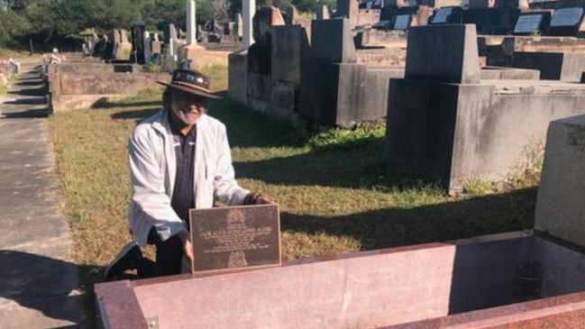 Pastor Ray Minniecon from Scarred Tree Ministries in Glebe at Alick Bond's unmarked grave in Botany.