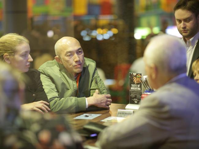 Residents of the Mascot Towers talk to the Owners Corporation staff before the meeting. Picture: Christian Gilles