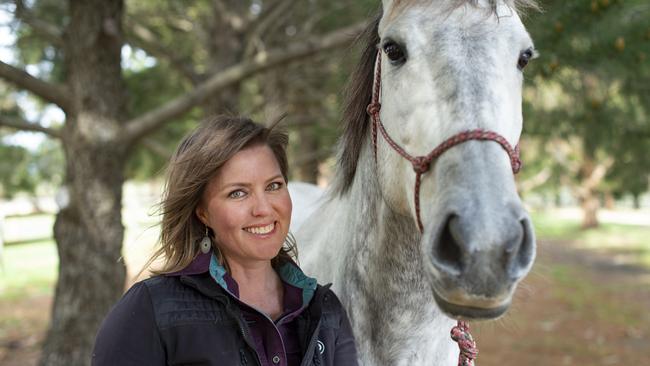 Horse trainer Tamara Coakley with her horses on her farm near Kyneton. Picture: Zoe Phillips