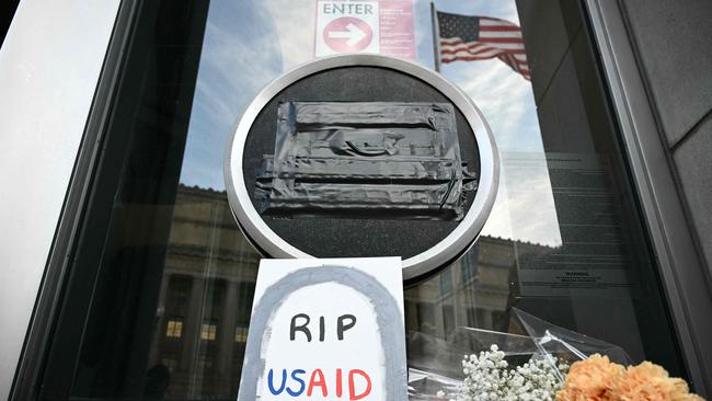 Tributes are placed beneath the covered seal of the US Agency for International Development (USAID) at its headquarters in Washington, DC, on February 7, 2025. Picture: Mandel Ngan / AFP