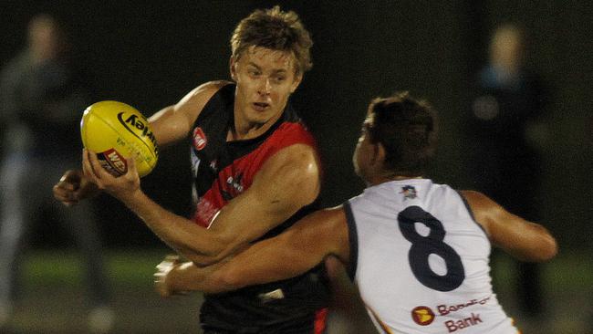 West Adelaide v Adelaide at St Kilda Oval. [PIC] West's Joshua Schiller is tackled by Adelaide's Mitchell Grigg pic by Bianca De Marchi - 17.4.15