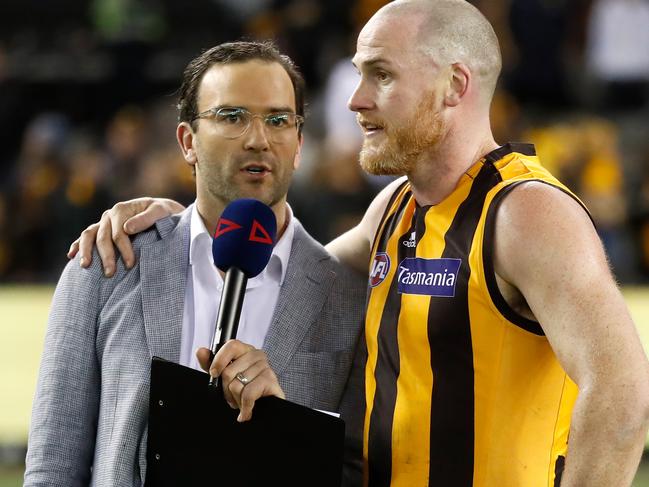 Jarryd Roughead and Jordan Lewis (left) chat after the big Hawk’s farewell match in 2019.