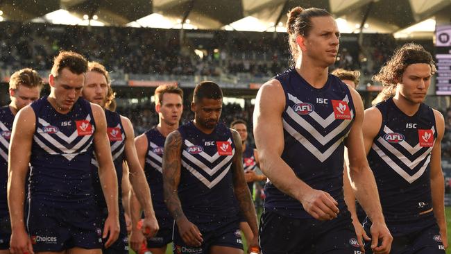 Nat Fyfe leads off the young Fremantle team after they were thumped by Geelong.