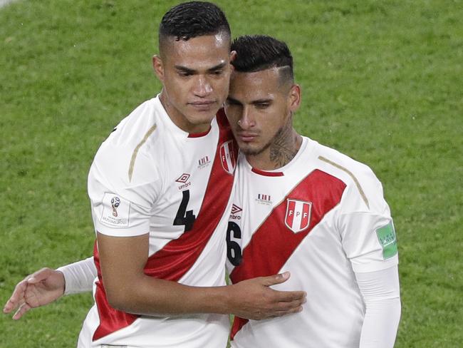 Peru's Anderson Santamaria, left, and Peru's Miguel Trauco react at the end of the group C match between France and Peru at the 2018 soccer World Cup in the Yekaterinburg Arena in Yekaterinburg, Russia, Thursday, June 21, 2018. (AP Photo/Mark Baker)