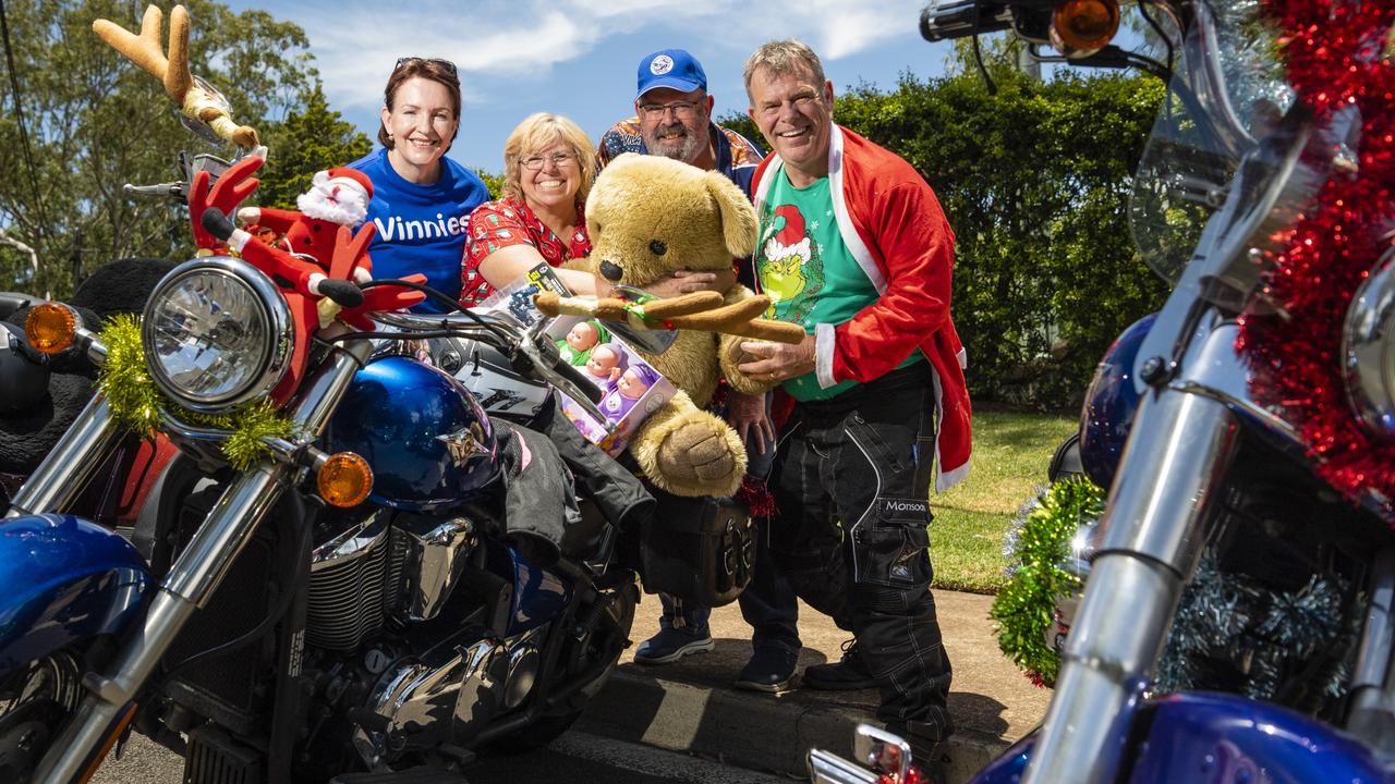 St Vincent de Paul Society volunteer Christine Harpham (left) and Toowoomba president Peter Cavanagh (centre) with riders Allison and John McCreanor of Brisbane Ulysses Club at Picnic Point for the Toowoomba Toy Run hosted by Downs Motorcycle Sporting Club, Sunday, December 18, 2022.