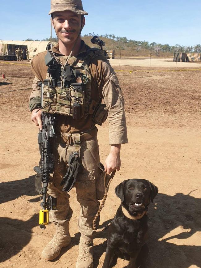 New Zealand Army Sapper Sean O’Keeffe and his explosive detector dog Inky. Picture: Jodie Munro O’Brien