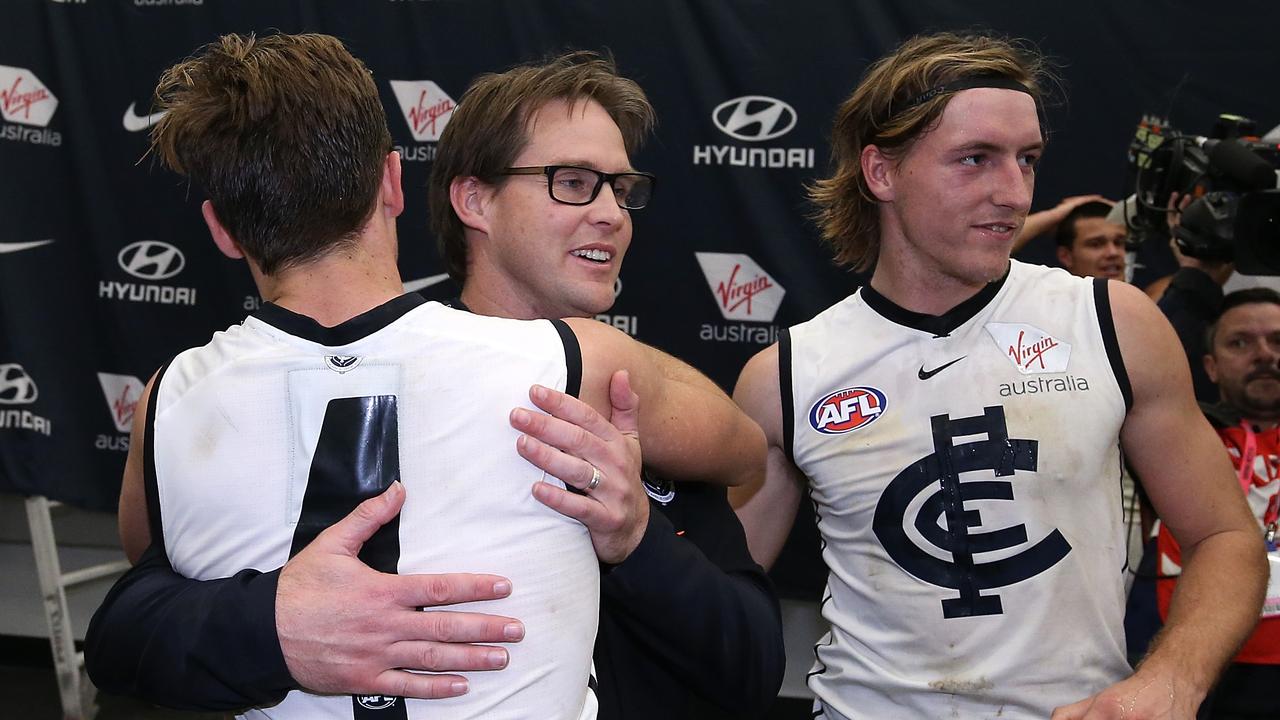 David Teague celebrates with Lochie O'Brien on Sunday night.