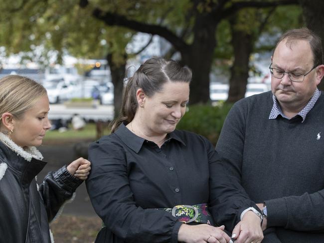Grace Tame, Katrina Munting and her husband Danny Munting at Parliament lawns, Hobart. Picture: Chris Kidd