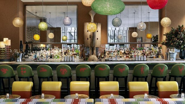 Striped banquettes in the bar of The Crosby Hotel.