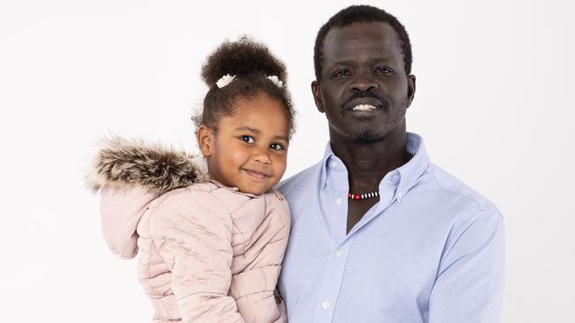 Ayik Chut and daughter Sunday 3, of Brisbane. Ayik has recently returned from volunteering in Ukraine, surviving a Russian air raid that killed 35 people. Picture: David Kelly