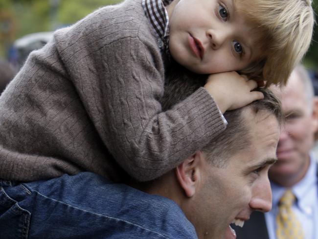 Special bond ... Captain Beau Biden carries his son Hunter, 3, on his shoulders in 2009 after an official welcome home ceremony for members of the Delaware Army National Guard. Picture: AP/Rob Carr