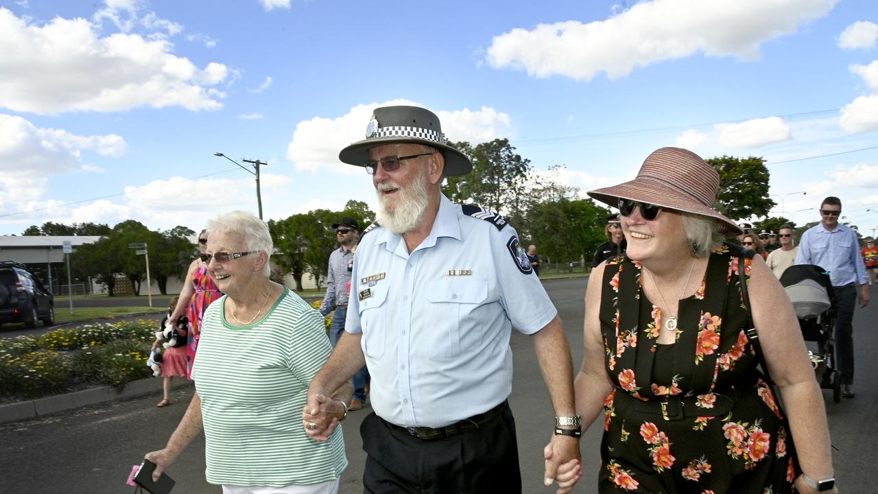 Sergeant Steve Ryan with his wife Margaret (right) and mother Desley on Sgt Ryan's victory march down Walpole St, Millmerran, marking his retirement from the Queensland Police Service.