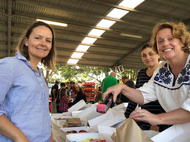 Parent volunteers at a cake stall at Narraweena Public School.