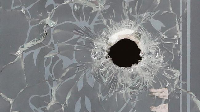 A bullet hole is seen in front door after the drive-by shooting in Narre Warren. Picture: Getty Images