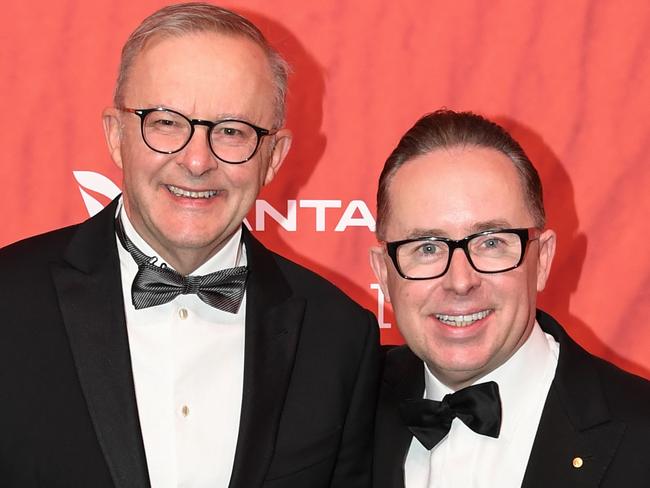 Australian Prime Minister Anthony Albanese (L) stands with Qantas CEO Alan Joyce as they attend the Qantas 100th Gala Dinner at Jetbase 96 hangar at Sydney's International Airport on March 31, 2023 in Sydney, Australia.