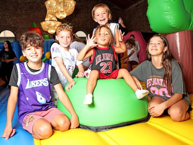 Malek Mikhail and friends enjoying the jumping castle