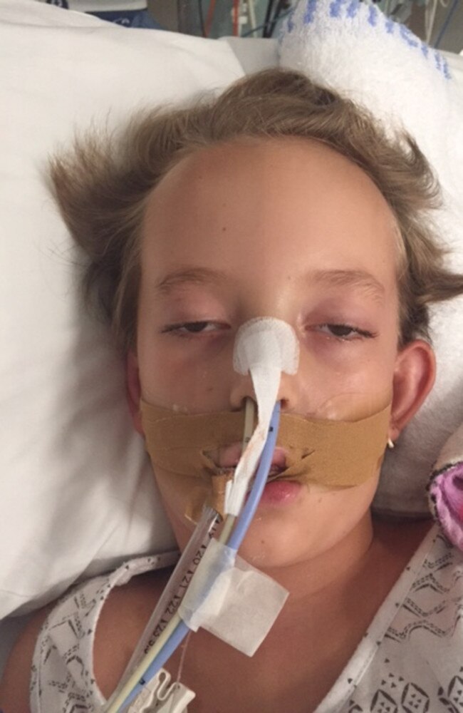 Eight-year-old Sienna Santiago in intensive care at the Royal Darwin Hospital in 2019. Her family believe her medical episode was caused by exposure to mould within their family home provided to them by NT Police. Picture: Supplied.