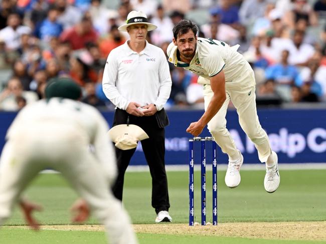 Australian bowler Mitchell Starc sends down a delivery on the first day of the second cricket Test match between Australia and India at the Adelaide Oval in Adelaide on December 6, 2024. (Photo by William WEST / AFP) / --IMAGE RESTRICTED TO EDITORIAL USE - STRICTLY NO COMMERCIAL USE--