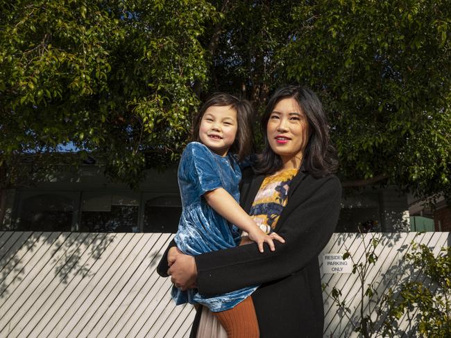 Kuan Zhou and daughter Evelyn outside their home in Brunswick, Melbourne. Picture: Daniel Pockett.