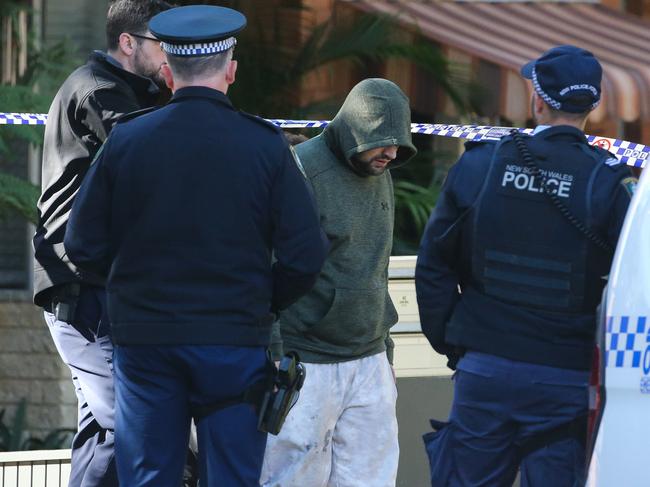 SYDNEY, AUSTRALIA : Newswire Photos- JULY 15 2024: Police and Detectives are at the scene of a unit complex in Dee Why in Sydney where a crime scene has been established after a body was found. A police negotiator was at the scene to assist and the Police arrested and walked out a man in the green hoodie.About 7:11am today (Monday 15 July 2024), emergency services were called to Ilikai Place, Dee Why, following reports of a body in a carpark. Picture: Newswire / Gaye Gerard