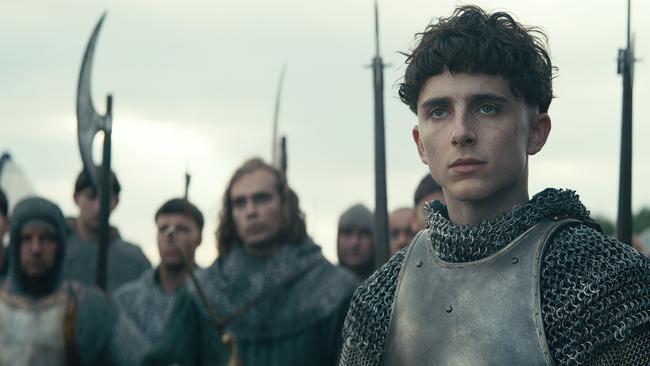 This image released by Netflix shows TimothÃ©e Chalamet, center, in a scene from "The King." (Netflix via AP)