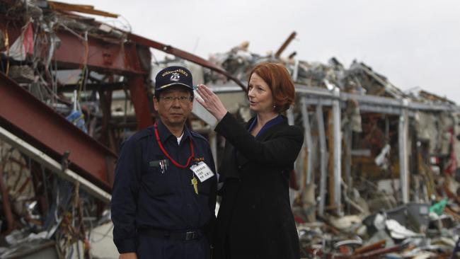 Then prime minister Julia Gillard with Minamisanriku Mayor Jin Sato in April 2011, a month after the tsunami. Picture: AP.