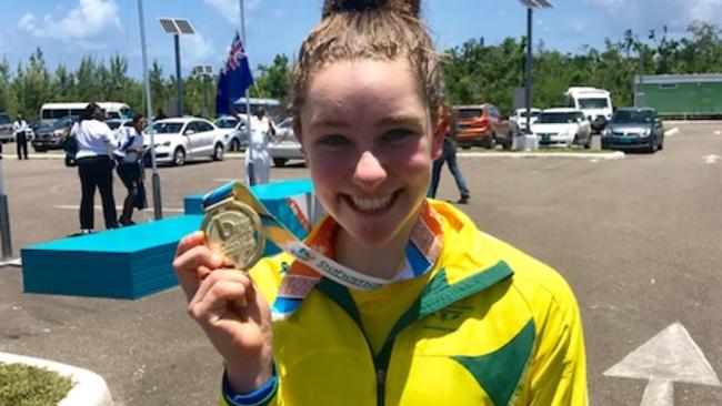 Madeleine Fasnacht celebrates with her Commonwealth Youth Games gold medal.