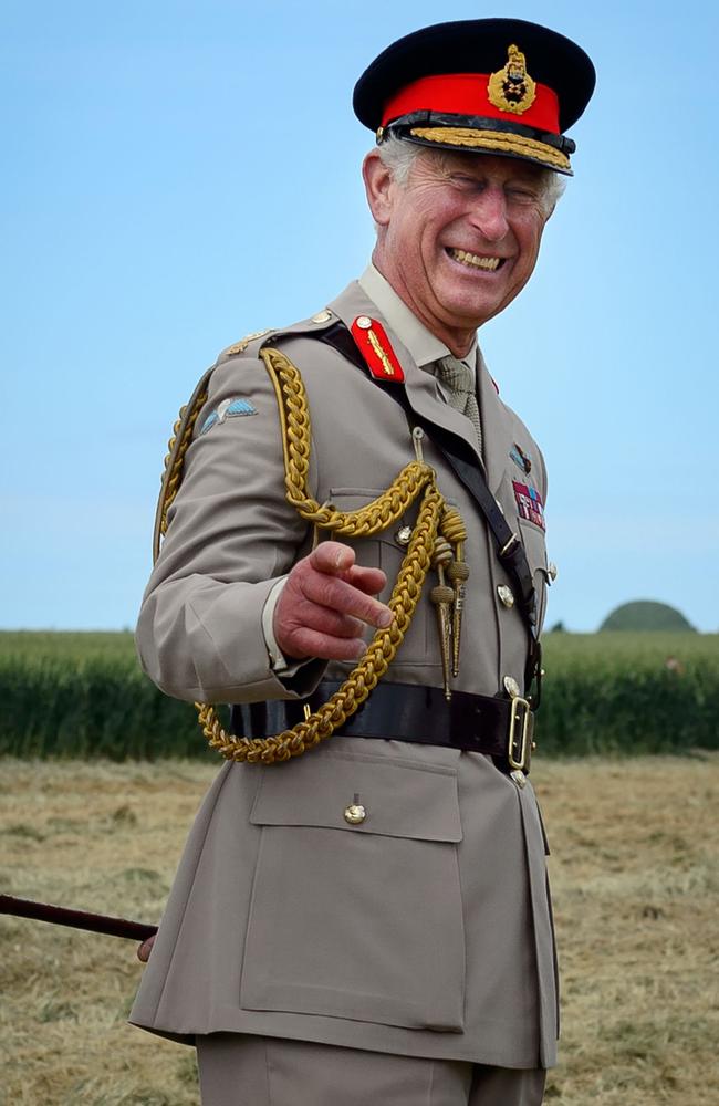 The Prince of Wales reacts as he watches teams of paratroopers jumping from aeroplanes during a D-Day commemoration in Ranville, northern France, 2014. Picture: AP